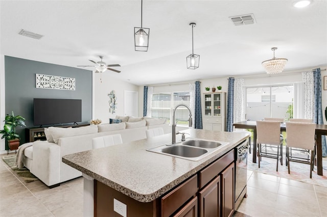 10105 Paradise Fish Dr, Riverview, FL 33578 - kitchen featuring a sink, visible vents, a wealth of natural light, and decorative light fixtures