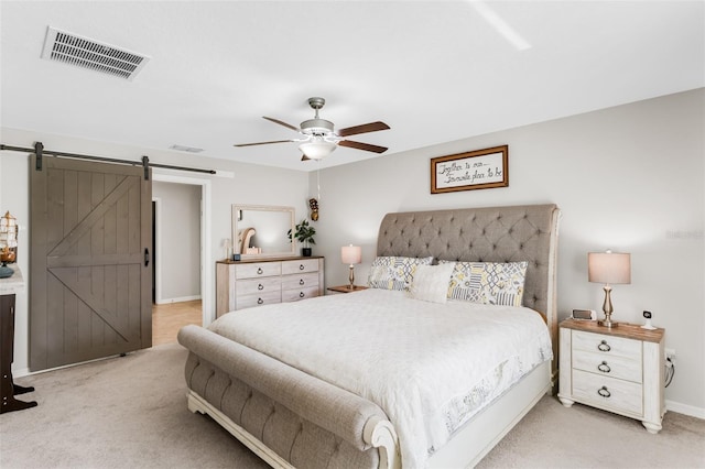10105 Paradise Fish Dr, Riverview, FL 33578 - bedroom featuring visible vents, light colored carpet, a barn door, and ceiling fan
