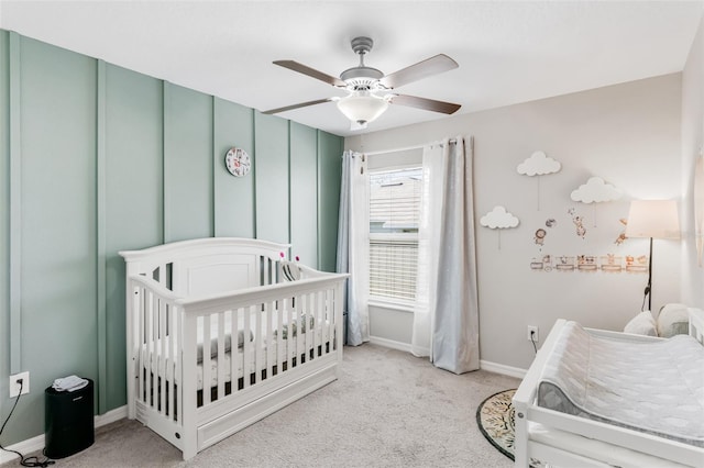 10105 Paradise Fish Dr, Riverview, FL 33578 - carpeted bedroom featuring baseboards, a crib, and a ceiling fan