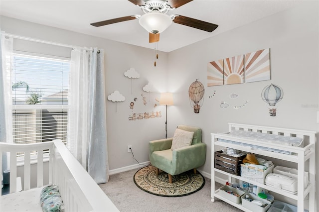 10105 Paradise Fish Dr, Riverview, FL 33578 - carpeted bedroom featuring baseboards, a crib, and a ceiling fan