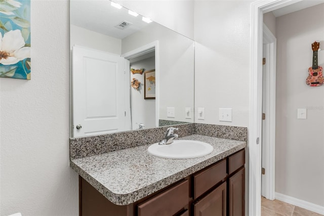 10105 Paradise Fish Dr, Riverview, FL 33578 - bathroom with tile patterned flooring, visible vents, vanity, and baseboards