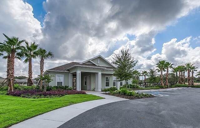 10105 Paradise Fish Dr, Riverview, FL 33578 - view of front of home featuring stucco siding and a front yard