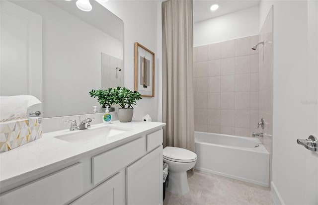 full bathroom with tile patterned floors, toilet, shower / bath combo with shower curtain, and vanity