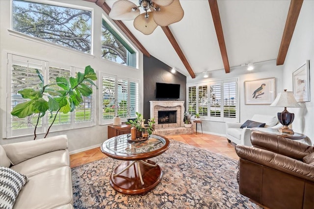 tiled living area with a brick fireplace, beamed ceiling, baseboards, and high vaulted ceiling