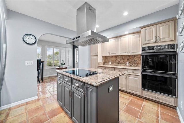 kitchen featuring black appliances, gray cabinetry, island exhaust hood, tasteful backsplash, and a center island