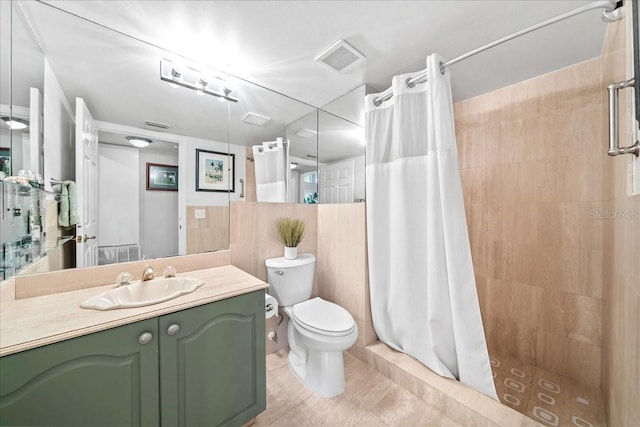 bathroom featuring visible vents, toilet, and a stall shower