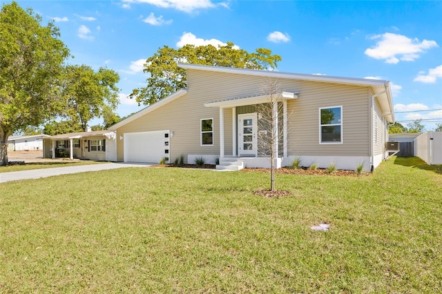 view of front of home with an attached garage, concrete driveway, a front lawn, and fence