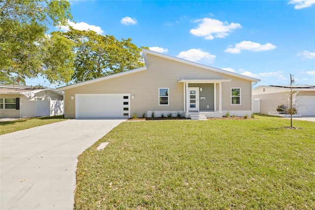 mid-century home with a front lawn, an attached garage, driveway, and fence