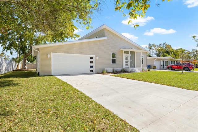 view of front of house featuring a garage, concrete driveway, a front yard, and fence