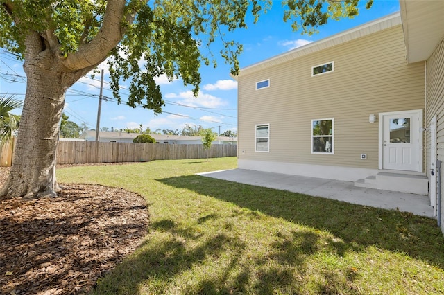 view of yard featuring fence and a patio area