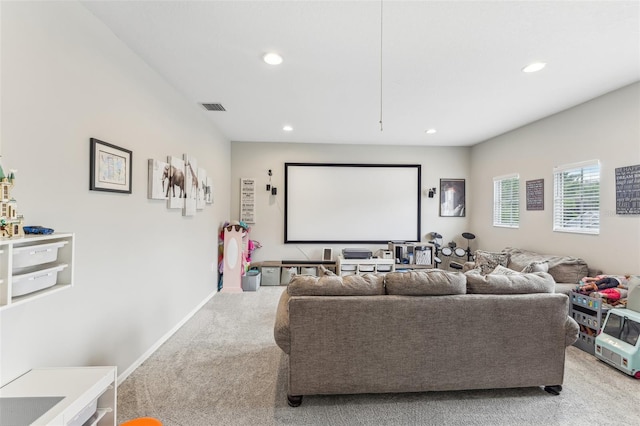 home theater room with recessed lighting, visible vents, light colored carpet, and baseboards