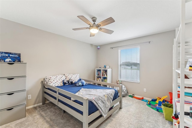 bedroom featuring baseboards, carpet floors, and ceiling fan