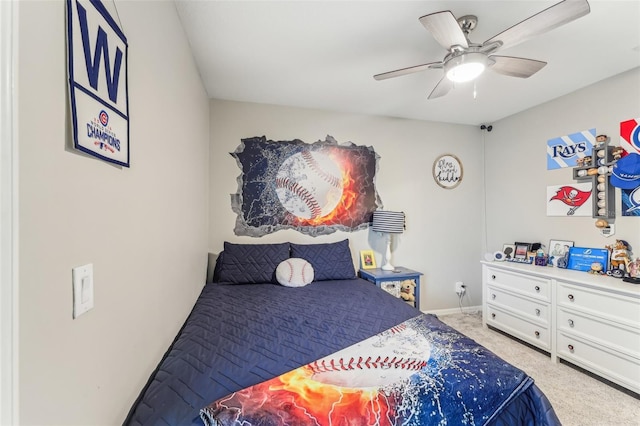 bedroom featuring a ceiling fan, baseboards, and light carpet