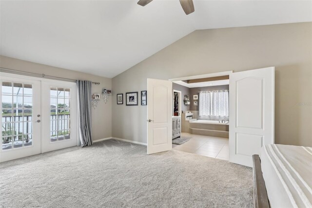 interior space with french doors, a ceiling fan, and vaulted ceiling