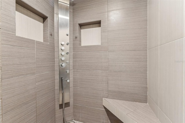 bathroom featuring tiled shower