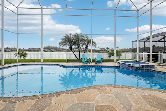 view of pool with glass enclosure, a patio, fence, and a pool with connected hot tub