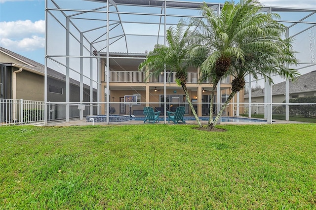 exterior space featuring a lanai, a lawn, a fenced in pool, and a patio area