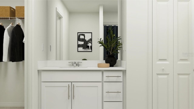 bathroom featuring a closet and vanity