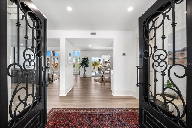 517 Belle Isle Ave, Belleair Beach, FL 33786 - entryway featuring wood finished floors, recessed lighting, baseboards, and visible vents