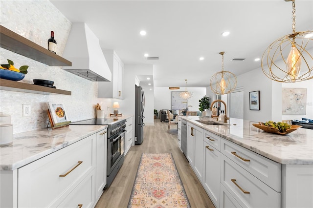 517 Belle Isle Ave, Belleair Beach, FL 33786 - kitchen with a sink, open shelves, appliances with stainless steel finishes, premium range hood, and visible vents
