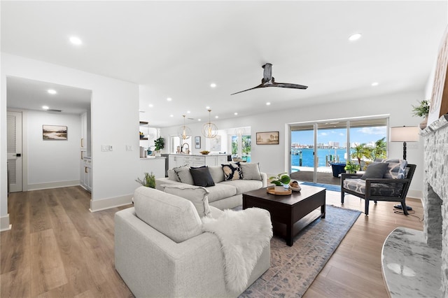 517 Belle Isle Ave, Belleair Beach, FL 33786 - living area with a ceiling fan, baseboards, light wood-style floors, and recessed lighting