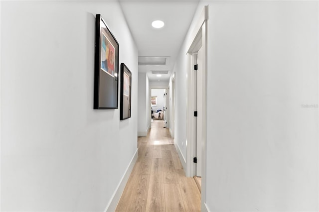 517 Belle Isle Ave, Belleair Beach, FL 33786 - hallway featuring attic access, baseboards, light wood-style flooring, and recessed lighting