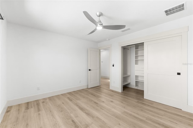 517 Belle Isle Ave, Belleair Beach, FL 33786 - unfurnished bedroom with baseboards, visible vents, a closet, and light wood-type flooring