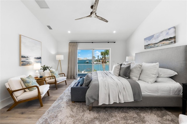 517 Belle Isle Ave, Belleair Beach, FL 33786 - bedroom with wood finished floors, access to outside, lofted ceiling, and visible vents