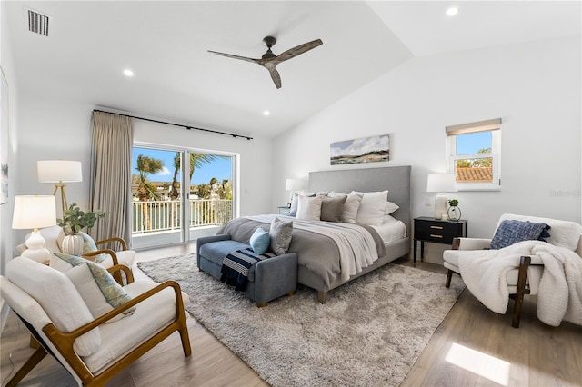 517 Belle Isle Ave, Belleair Beach, FL 33786 - bedroom with access to exterior, visible vents, light wood finished floors, and vaulted ceiling