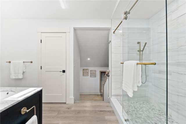 517 Belle Isle Ave, Belleair Beach, FL 33786 - full bathroom featuring vanity, wood finished floors, and a shower stall