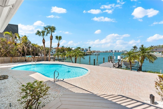 517 Belle Isle Ave, Belleair Beach, FL 33786 - view of pool featuring a water view, a fenced in pool, a boat dock, and fence