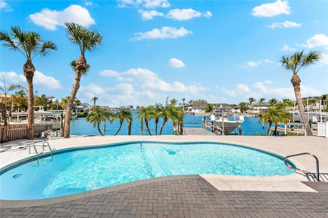 517 Belle Isle Ave, Belleair Beach, FL 33786 - outdoor pool with boat lift, a water view, a patio area, and a dock