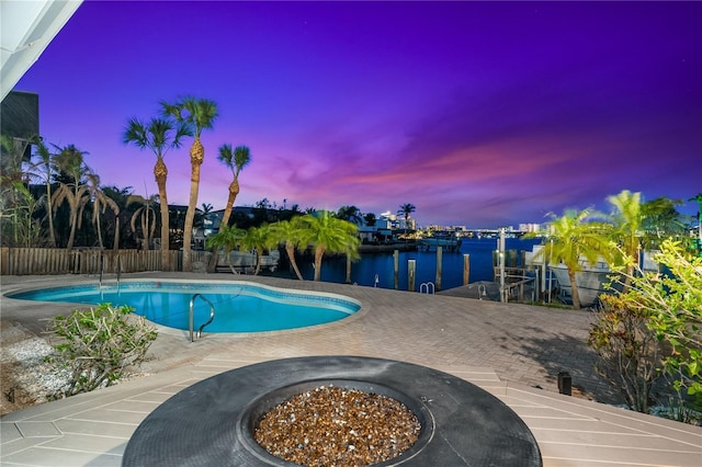 517 Belle Isle Ave, Belleair Beach, FL 33786 - view of swimming pool featuring a fenced in pool, fence, a dock, a patio, and a water view