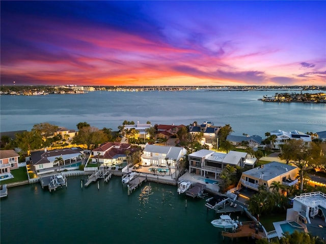 517 Belle Isle Ave, Belleair Beach, FL 33786 - aerial view at dusk featuring a water view