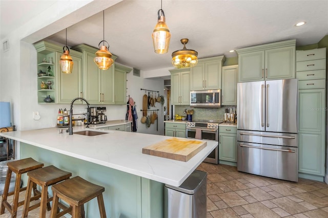 kitchen featuring green cabinetry, stainless steel appliances, open shelves, and a peninsula