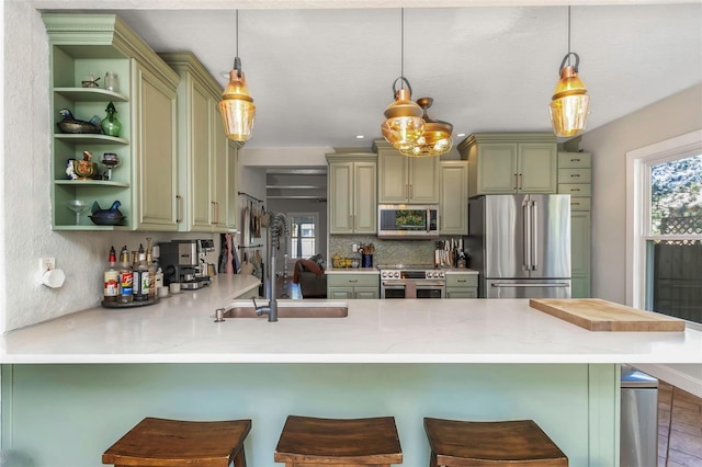 kitchen with open shelves, plenty of natural light, appliances with stainless steel finishes, and a peninsula