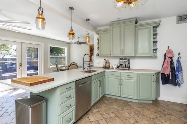 kitchen featuring visible vents, green cabinetry, dishwasher, a ceiling fan, and a sink