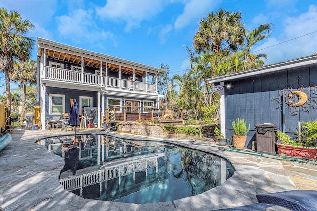 view of swimming pool with a patio