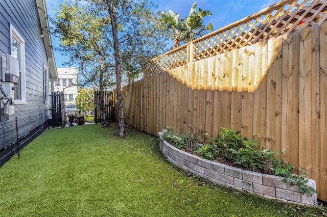 view of yard with a fenced backyard