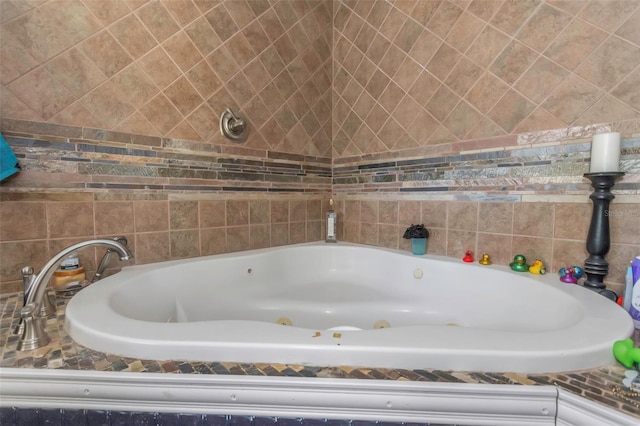 full bath with a whirlpool tub