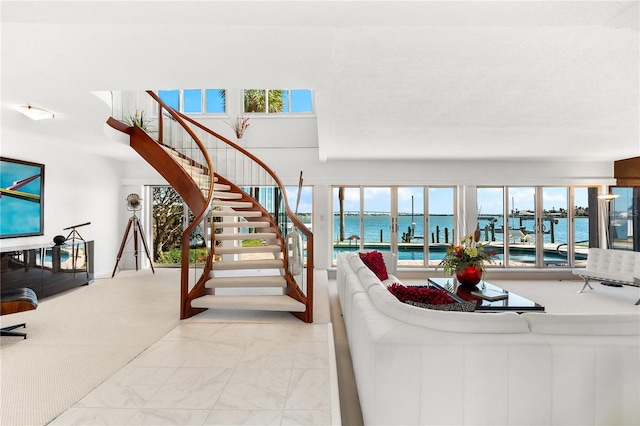 520 Belle Isle Ave, Belleair Beach, FL 33786 - living room with stairway, plenty of natural light, a water view, and marble finish floor