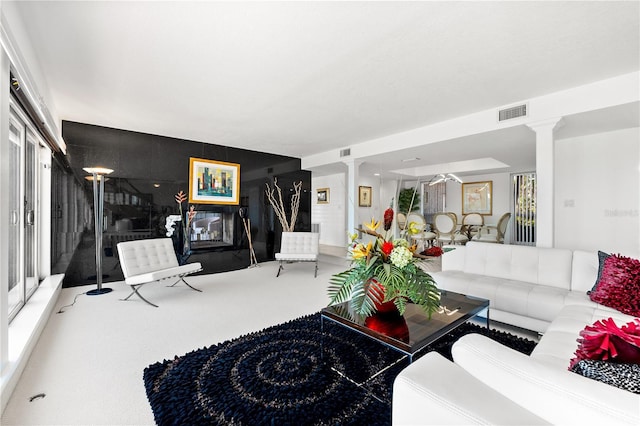 520 Belle Isle Ave, Belleair Beach, FL 33786 - living area with carpet flooring, decorative columns, and visible vents