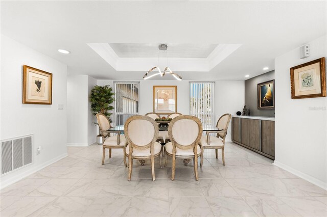 520 Belle Isle Ave, Belleair Beach, FL 33786 - dining area with a raised ceiling, baseboards, visible vents, and marble finish floor