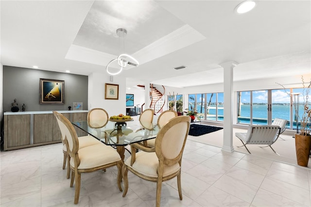 520 Belle Isle Ave, Belleair Beach, FL 33786 - dining area with a tray ceiling, stairway, decorative columns, and a water view