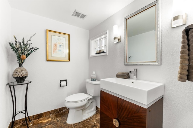 520 Belle Isle Ave, Belleair Beach, FL 33786 - half bath with visible vents, toilet, vanity, and baseboards