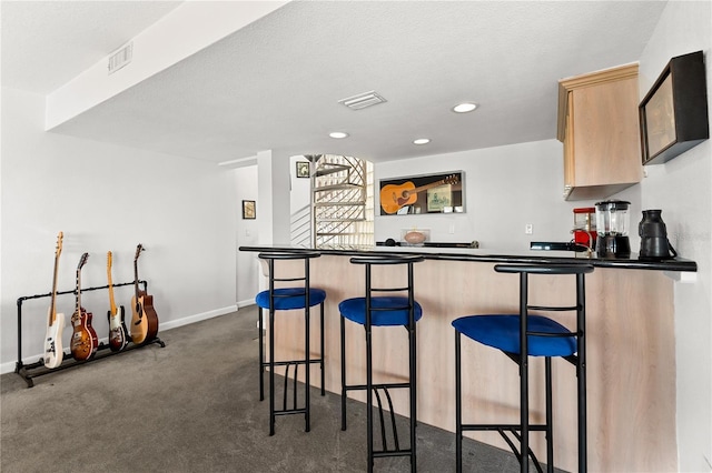 520 Belle Isle Ave, Belleair Beach, FL 33786 - bar with visible vents, bar, dark carpet, and baseboards