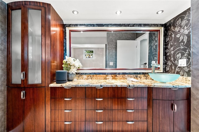 520 Belle Isle Ave, Belleair Beach, FL 33786 - bathroom featuring wallpapered walls, vanity, and ornamental molding