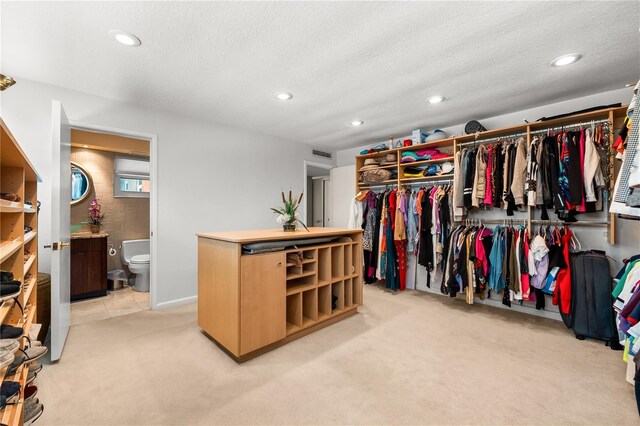 520 Belle Isle Ave, Belleair Beach, FL 33786 - walk in closet featuring visible vents and light carpet