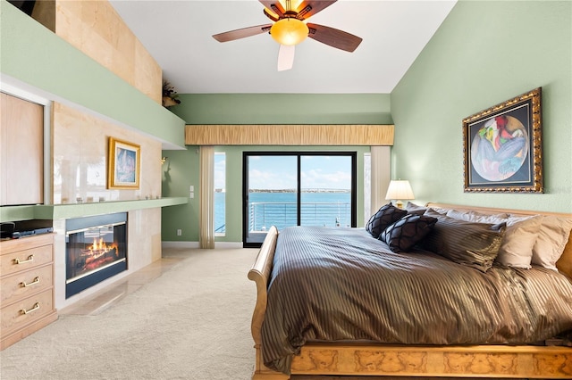 520 Belle Isle Ave, Belleair Beach, FL 33786 - bedroom with a fireplace with flush hearth, high vaulted ceiling, access to outside, carpet flooring, and ceiling fan
