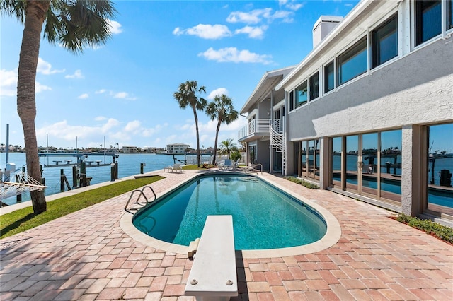 520 Belle Isle Ave, Belleair Beach, FL 33786 - pool with a patio area, a water view, a boat dock, and a diving board